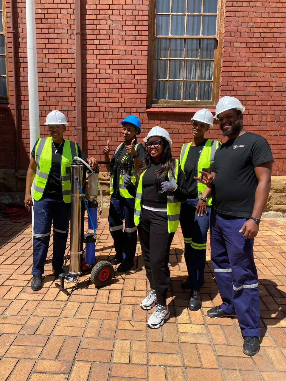 Solar training learners wearing hard hats and safety vests